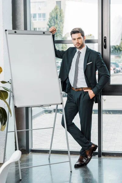 Young Businessman Suit Standing Empty White Board Office — Stock Photo, Image