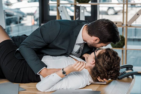 passionate businessman and businesswoman at workplace in office