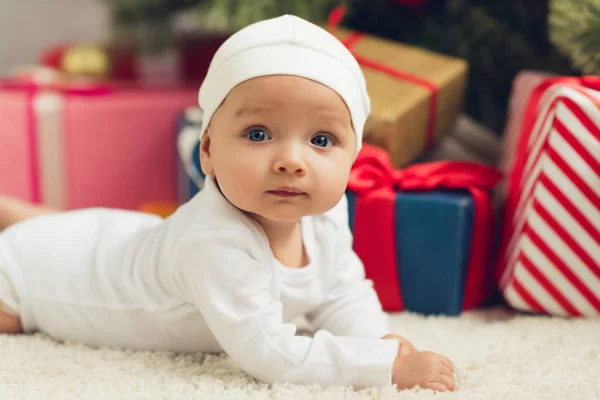 Close Portrait Adorable Little Baby Lying Floor Christmas Gifts Blurred — Stock Photo, Image