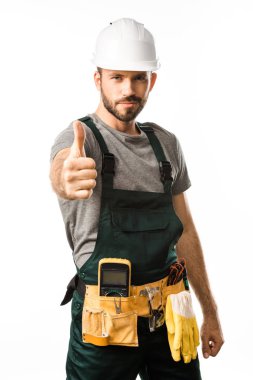 handsome electrician showing thumb up and looking at camera isolated on white clipart