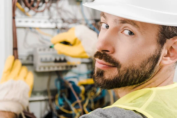 Handsome Bearded Electrician Repairing Electrical Box Using Screwdriver Corridor Looking — Stock Photo, Image
