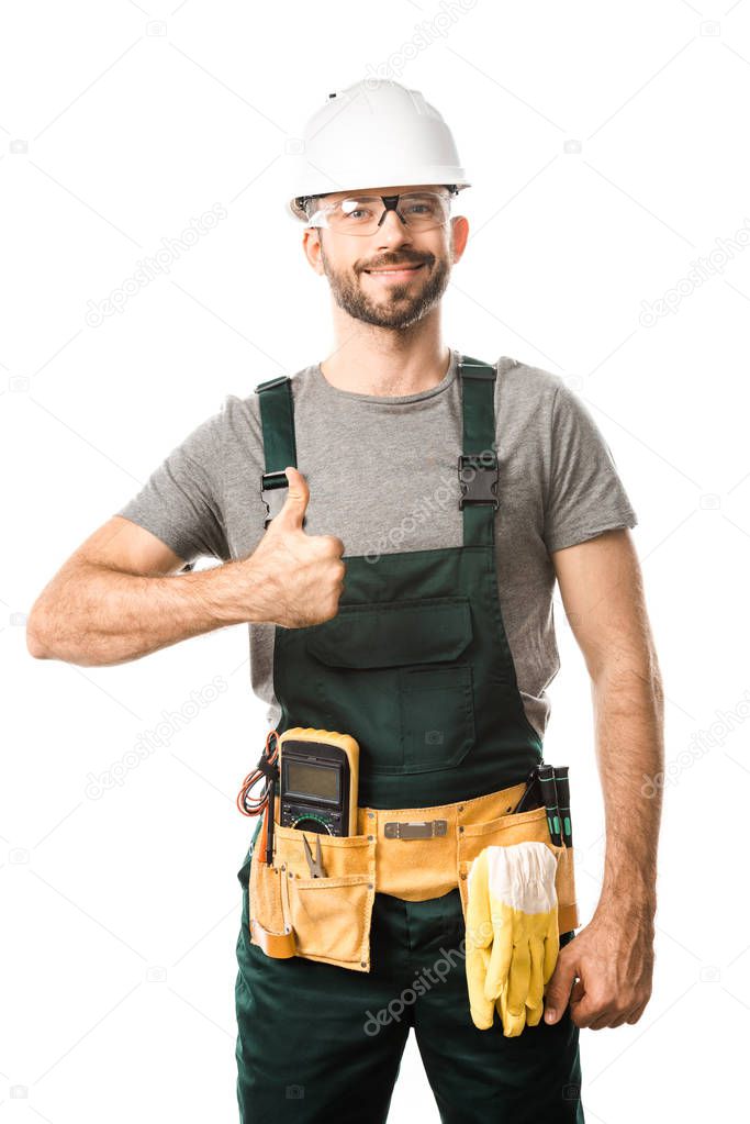 smiling handsome electrician showing thumb up isolated on white