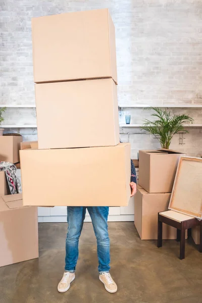 Young Man Holding Cardboard Boxes While Moving Home — Stock Photo, Image