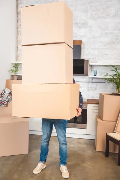 Man Holding Stack Cardboard Boxes While Moving Home — Stock Photo, Image