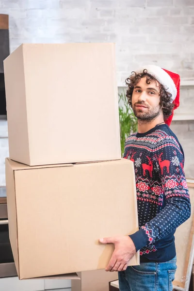 Handsome Young Man Santa Hat Holding Cardboard Boxes Smiling Camera — Stock Photo, Image
