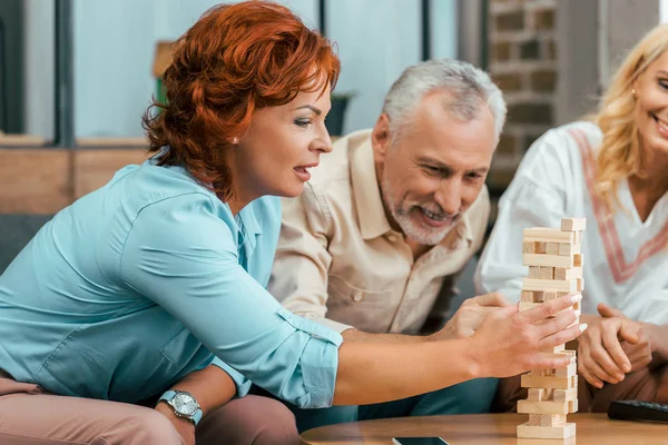 Beautiful Mature Woman Playing Wooden Blocks While Spending Time Old — Stock Photo, Image