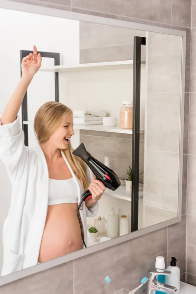 Happy Beautiful Pregnant Woman Bathrobe Singing Hair Dryer Front Mirror — Stock Photo, Image