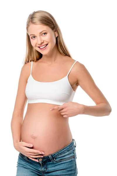 Smiling Pregnant Woman White Bra Pointing Her Tummy Isolated White — Free Stock Photo