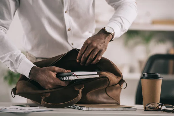 Cropped Image African American Businessman Putting Notebooks Briefcase Office — Stock Photo, Image