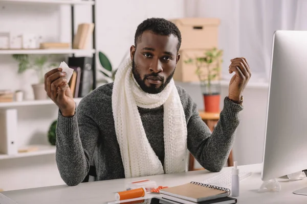 Diseased African American Man Holding Napkin While Sitting Workplace Medicines — Free Stock Photo