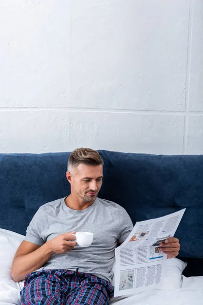 Smiling Businessman Cup Coffee Reading Business Newspaper Bed Morning Time — Stock Photo, Image