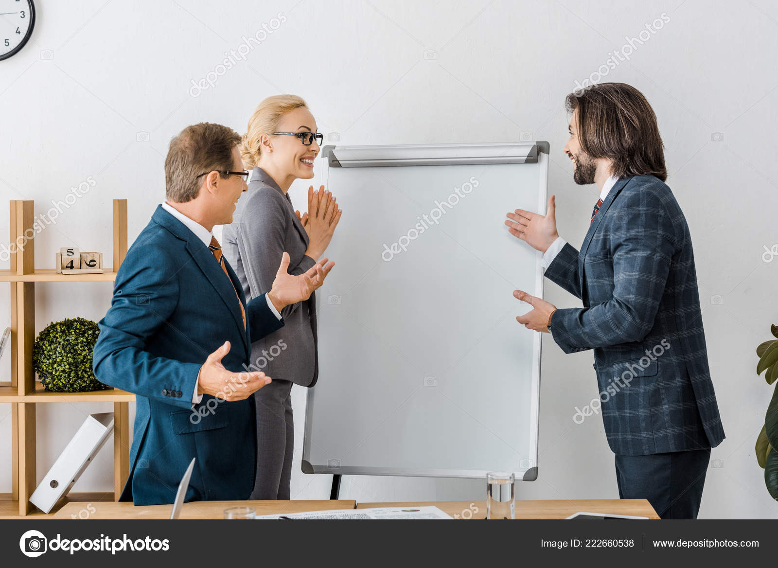 Smiling Office Workers Pointing White Board Meeting — Free Stock Photo ©  AndrewLozovyi #222660538