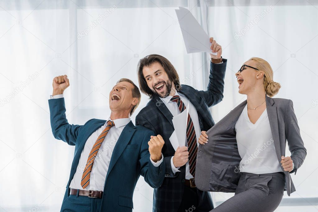 happy office workers rejoicing great deal in office