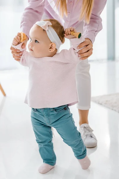 Toddler Daughter Walking Mother While Holding Chess Figure Cookie Hands — Stock Photo, Image