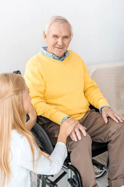 Female Doctor Holding Disabled Senior Patient Hand Clinic — Free Stock Photo