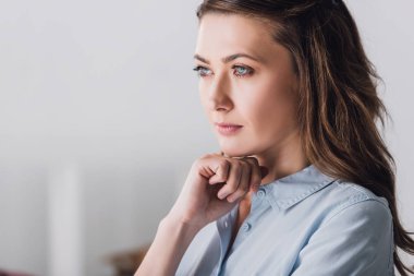 close-up portrait of thoughtful adult woman looking away clipart