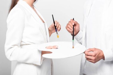 close up of artists in total white with drawing equipment isolated on white clipart