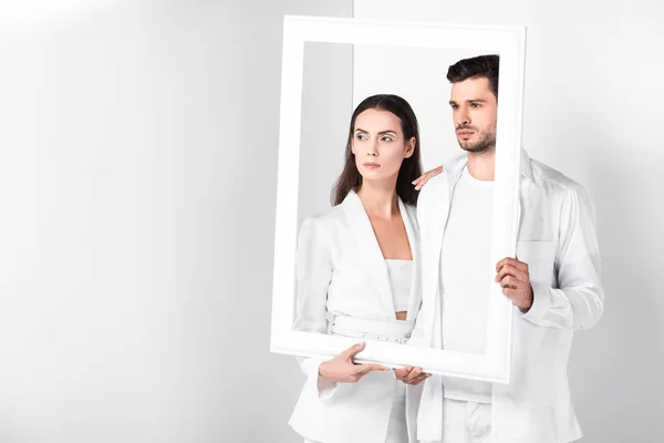 Adult Couple Holding White Frame Together — Stock Photo, Image