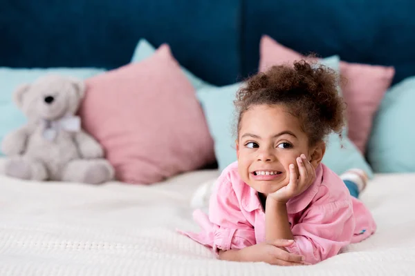 Adorable Curly African American Kid Lying Bed Smiling — Stock Photo, Image