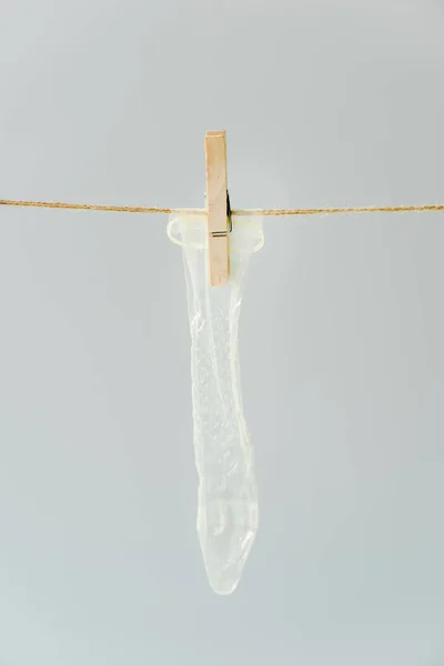 Close White Condom Hanging Clothesline Pin Isolated Grey — Stock Photo, Image