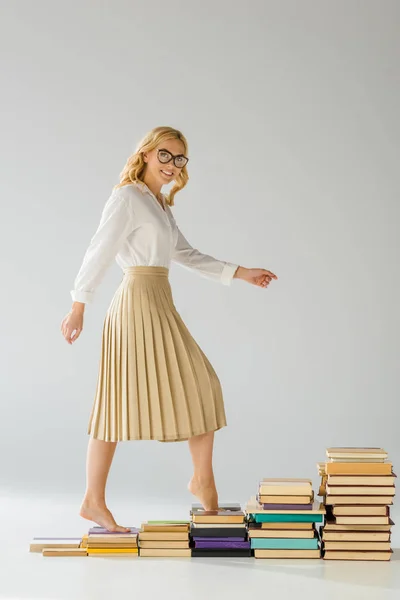 Smiling Woman Glasses Walking Steps Made Books — Stock Photo, Image