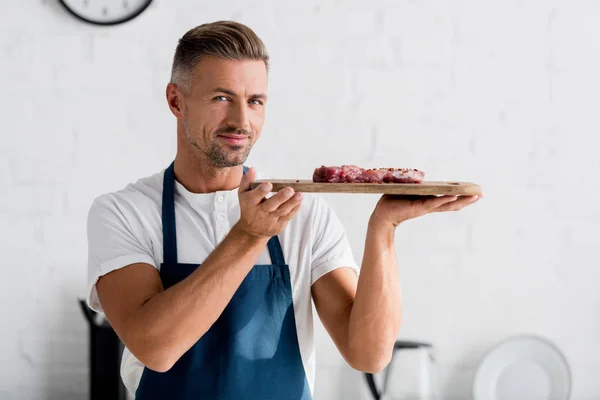 Adult Smiling Man Holding Steak Cutting Board — Stock Photo, Image