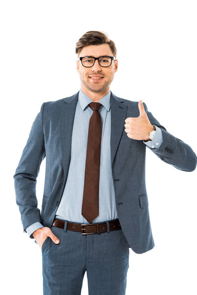 smiling businessman in glasses and suit showing thumbs up isolated on white