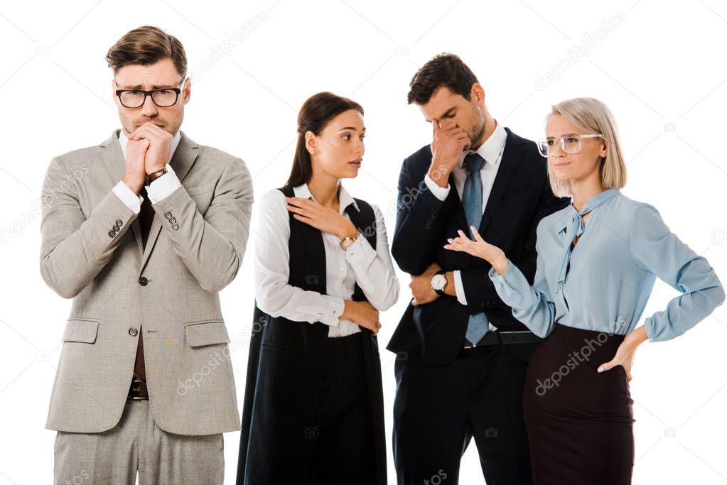 guilty worried businessman with colleagues behind isolated on white