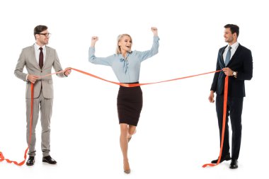 excited businesswoman reaching finishing line while businessmen holding red ribbon isolated on white clipart