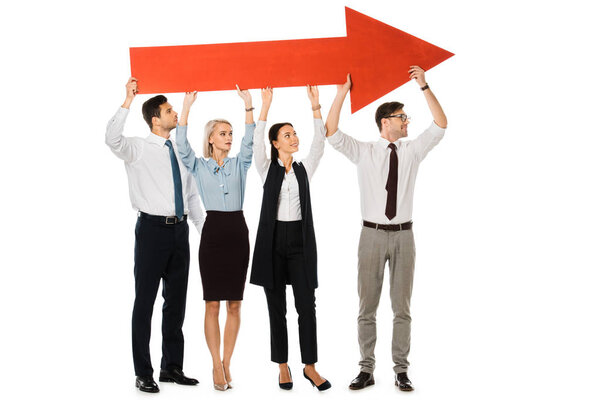 young businesspeople holding big red arrow isolated on white 