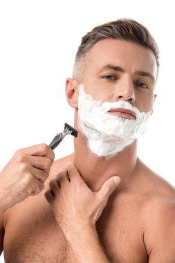 confident man with foam on face shaving with razor isolated on white clipart