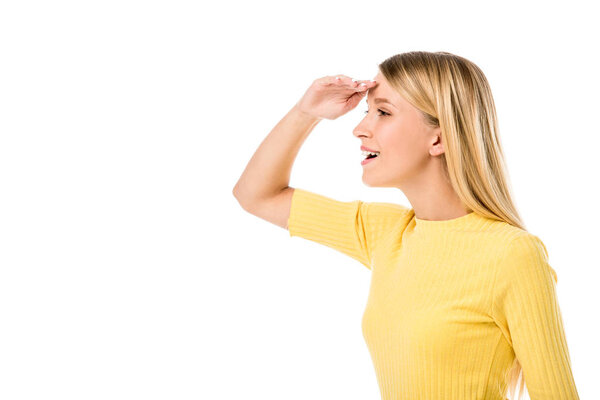 side view of smiling young woman with hand on forehead looking away isolated on white 