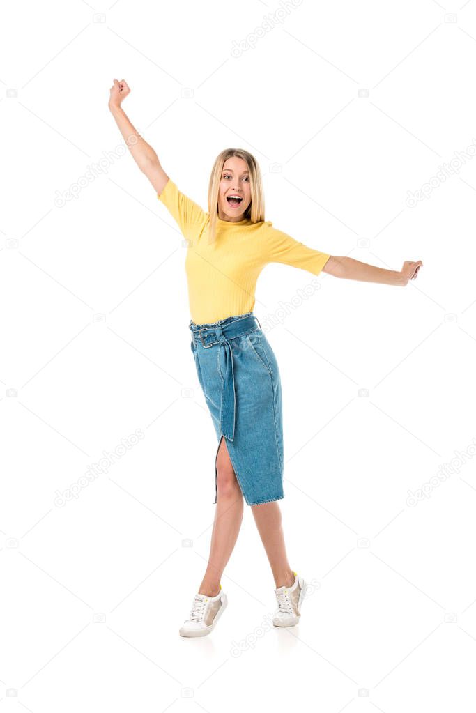 excited young woman with open arms smiling at camera isolated on white