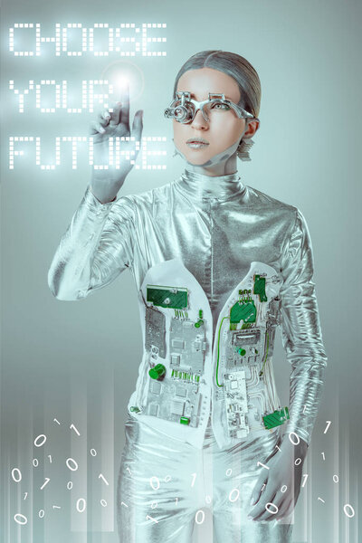 young cyborg touching "choose your future" lettering on grey with digital data, future technology concept 