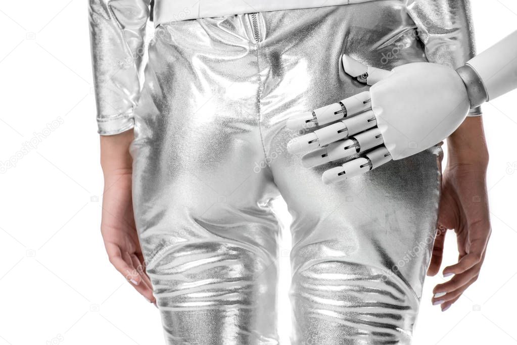 cropped image of robot touching buttocks of woman in silver clothes isolated on white, future technology concept
