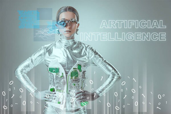futuristic silver cyborg standing with hands on waist and looking at camera on grey with "artificial intelligence" lettering and digital data