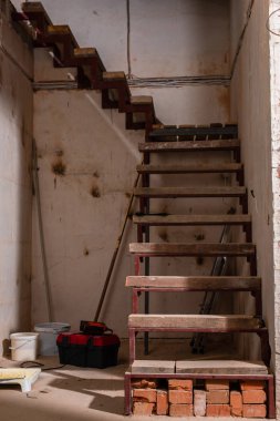 staircase in grungy house during renovation clipart