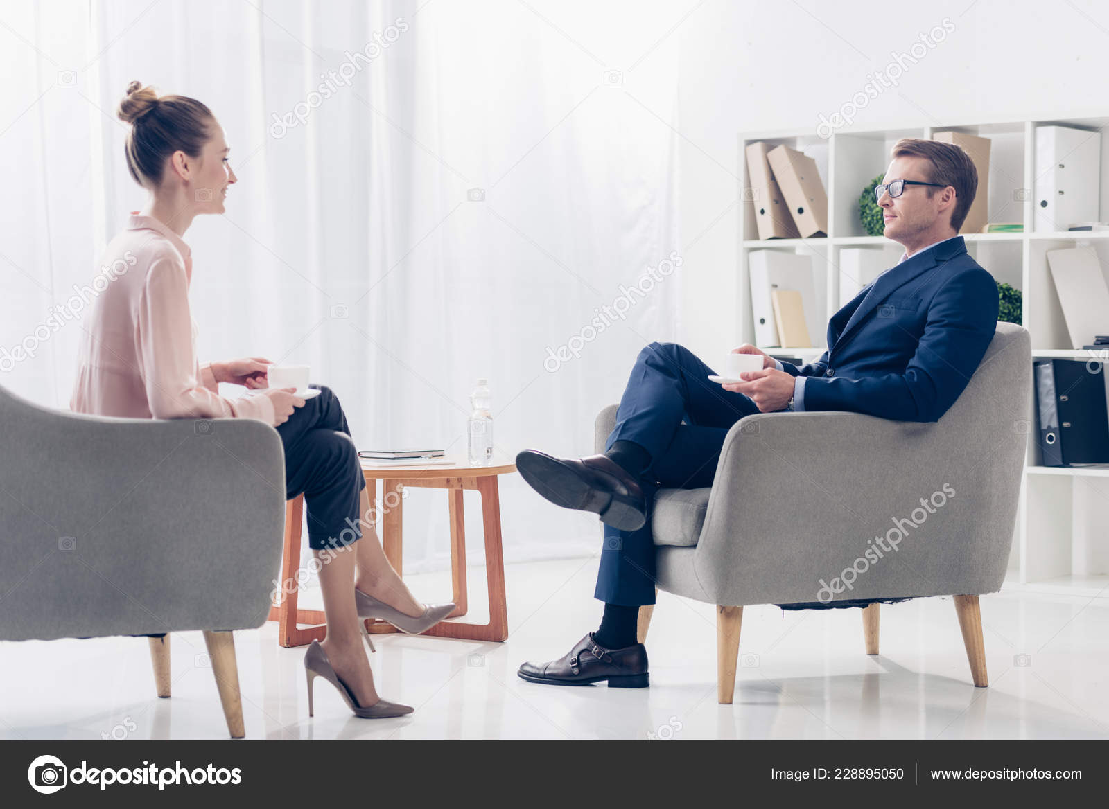 Side View Businessman Giving Interview Attractive Journalist Office Talking Sitting Stock Photo C Andrewlozovyi 228895050