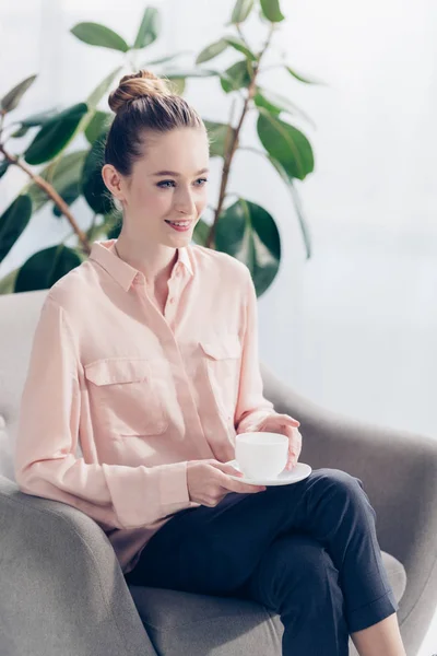 Cheerful Beautiful Businesswoman Sitting Cup Tea Armchair Office Looking Away — Free Stock Photo