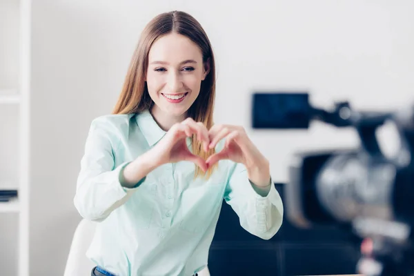 Happy Attractive Female Video Blogger Recording Vlog Showing Heart Fingers — Free Stock Photo