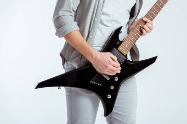 cropped view of man in grey clothing playing electric guitar isolated on white clipart