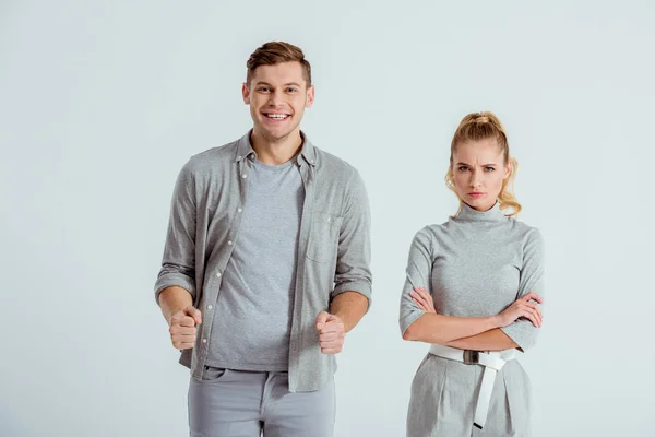 Excited Man Clenched Fists Dissatisfied Woman Arms Crossed Looking Camera — Stock Photo, Image