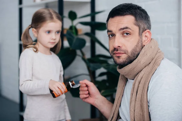 Adorable Daughter Pouring Medicines Spoon Sick Father Bedroom — Free Stock Photo