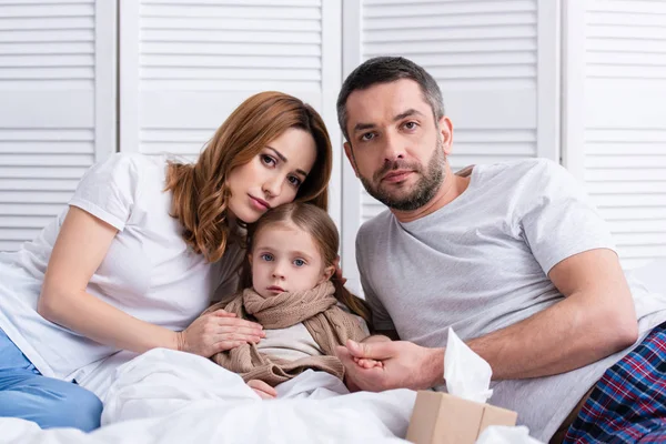 Parents Taking Care Sick Daughter Bedroom Looking Camera — Stock Photo, Image