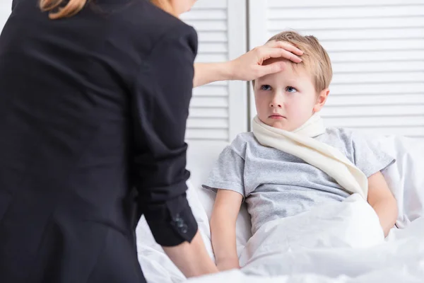 Mother Taking Care Sick Son Touching His Forehead Bedroom — Stock Photo, Image