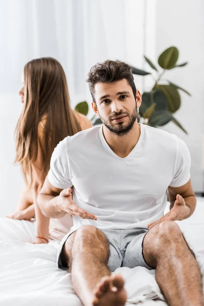 Young Dissatisfied Man Having Sexual Problems While Sitting Bed Next — Free Stock Photo