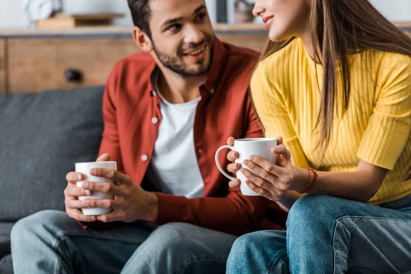 Cropped View Happy Couple Sitting Cups Living Room — Stock Photo, Image