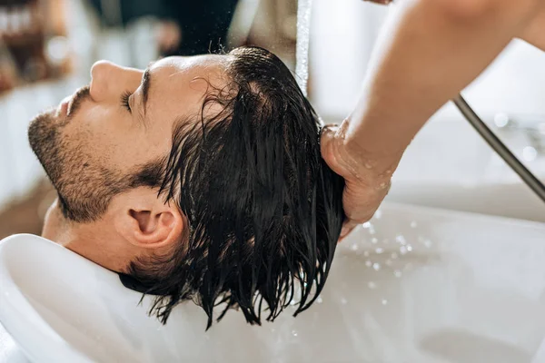 Cropped Shot Hairstylist Washing Hair Handsome Young Man Beauty Salon — Stock Photo, Image