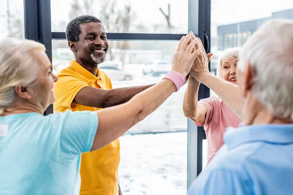 Selective Focus Senior Multicultural Sportspeople Putting Hands Together Gym — Stock Photo, Image
