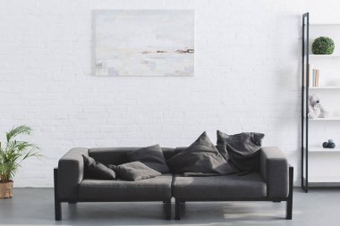 cozy grey sofa in modern living room interior